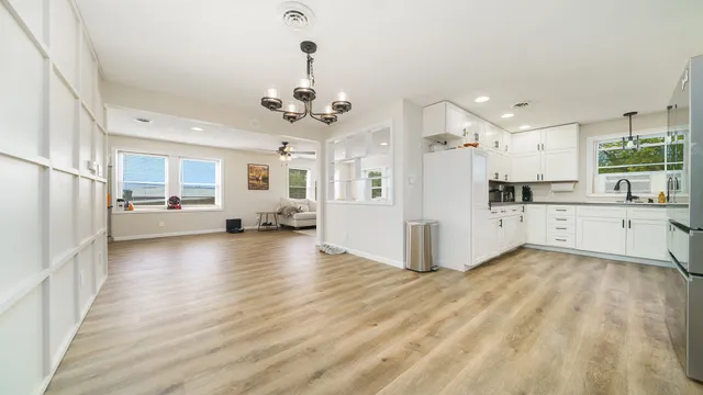 a view of a kitchen with a sink and cabinet