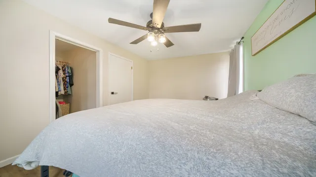 a view of a livingroom with a ceiling fan & a ceiling fan