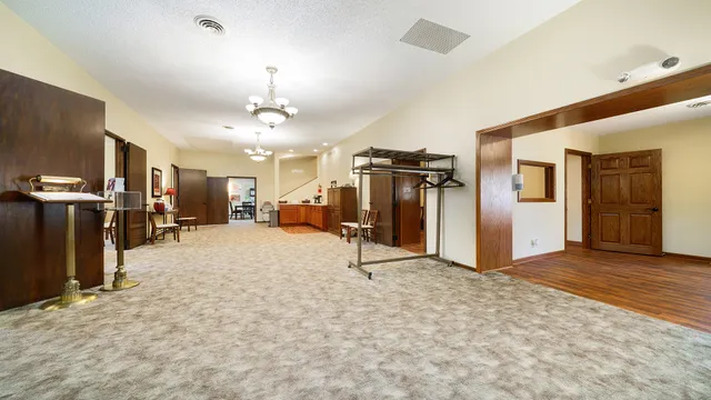 a view of a hallway with a flat screen tv