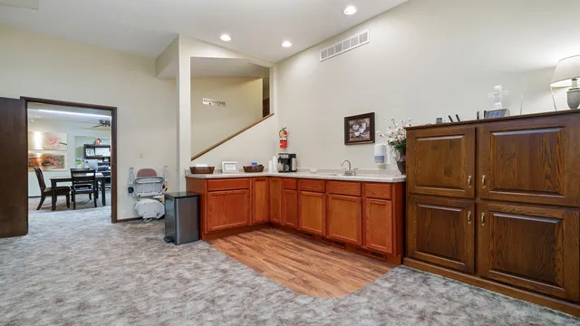 a kitchen with stainless steel appliances granite countertop a refrigerator and a sink