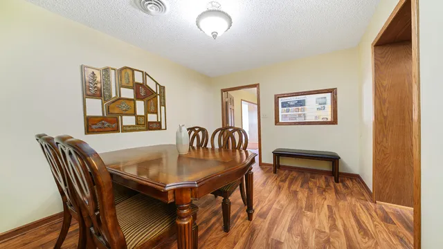 a dining room with furniture and window
