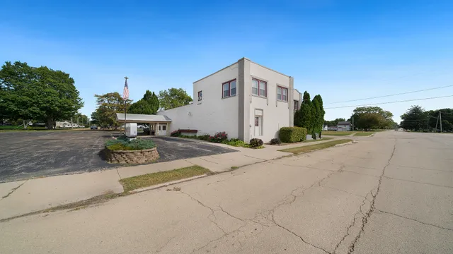 a view of a white house with a outdoor space