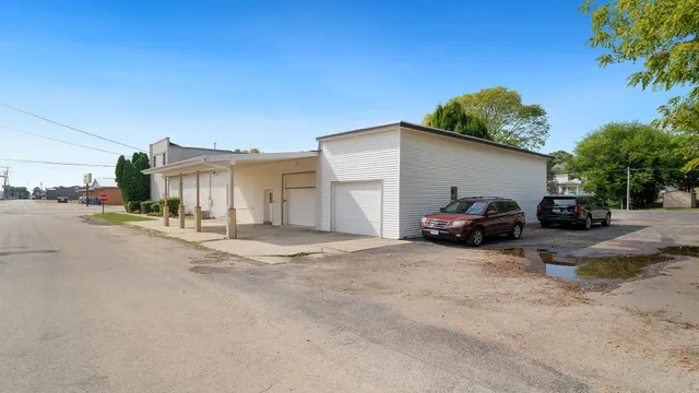 a view of a car parked in front of a house