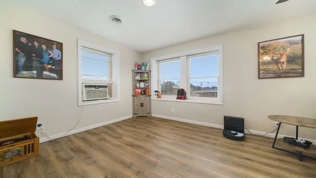 a view of workspace with wooden floor and window