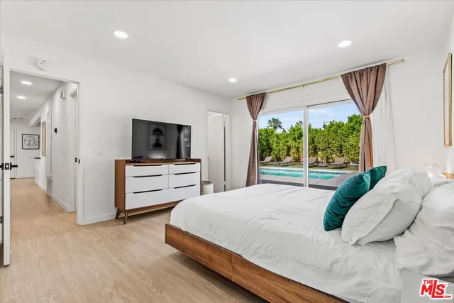 a bathroom with a sink mirror toilet and shower