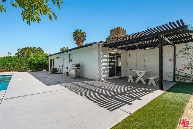 a view of park with large trees