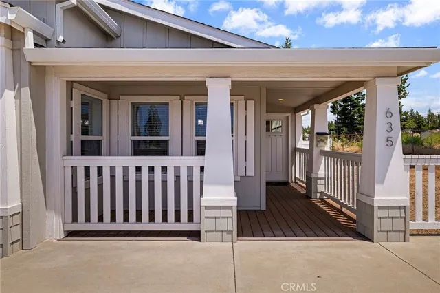 a view of a house with porch and wooden floor