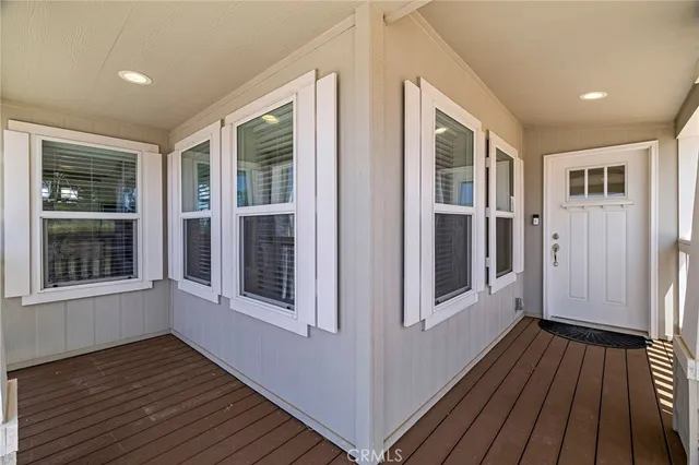 a view of a house with wooden floor and a window