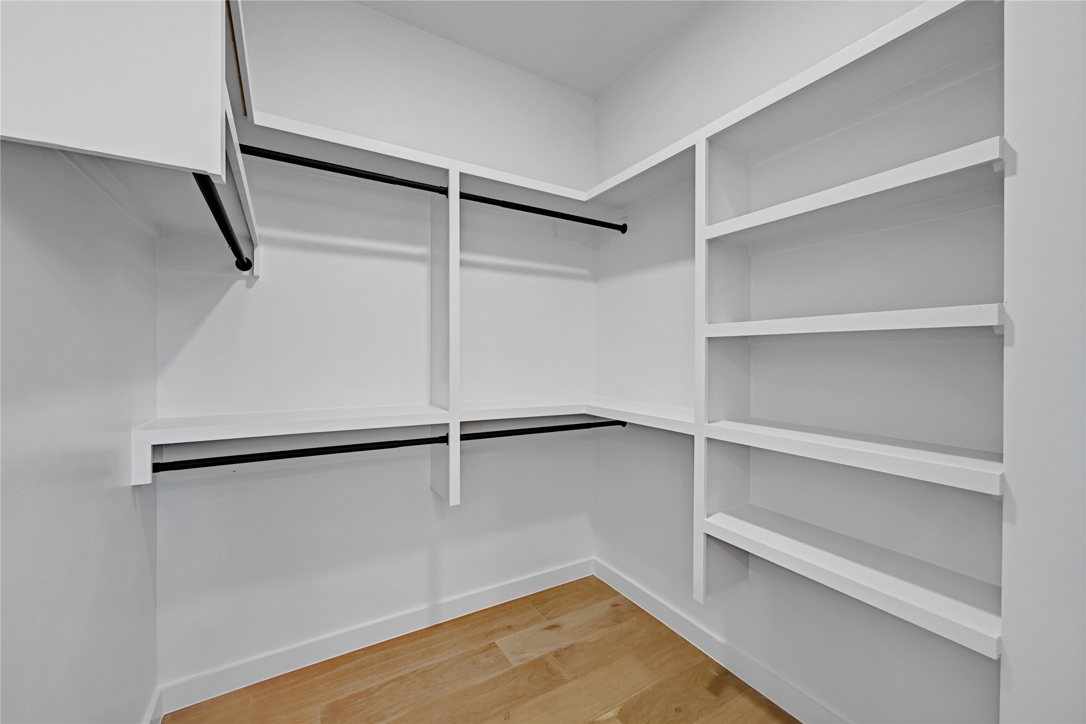 2717 Lyons Road, Unit 1 Austin, TX 78702 - Photo 19 of 34 Walk in closet with light wood-style floors