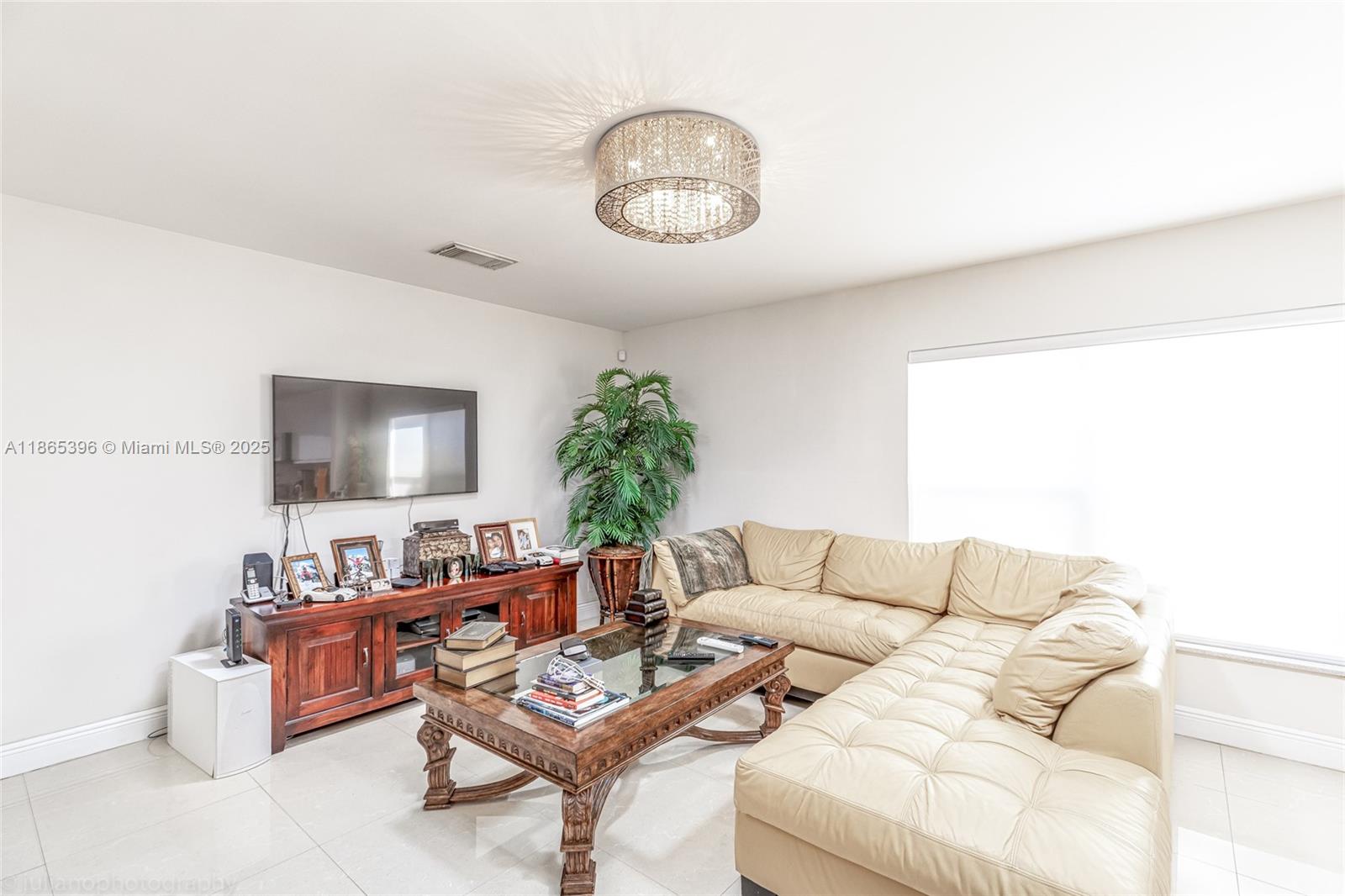 4913 Southwest 32nd Way Hollywood, FL 33312 - Photo 15 of 27 a living room with furniture and a potted plant