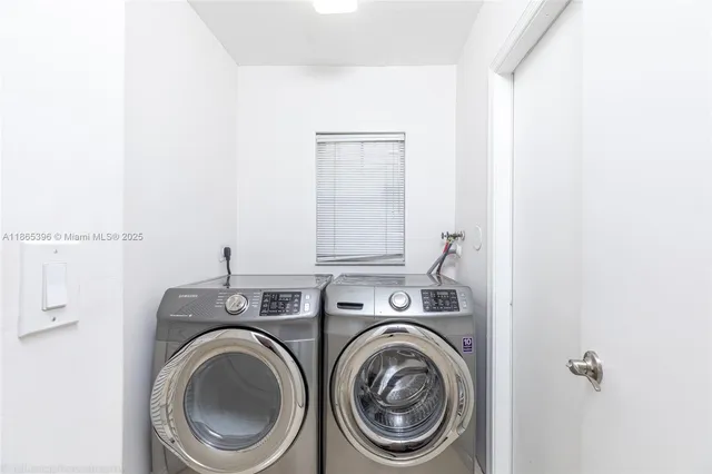 a utility room with dryer and washer