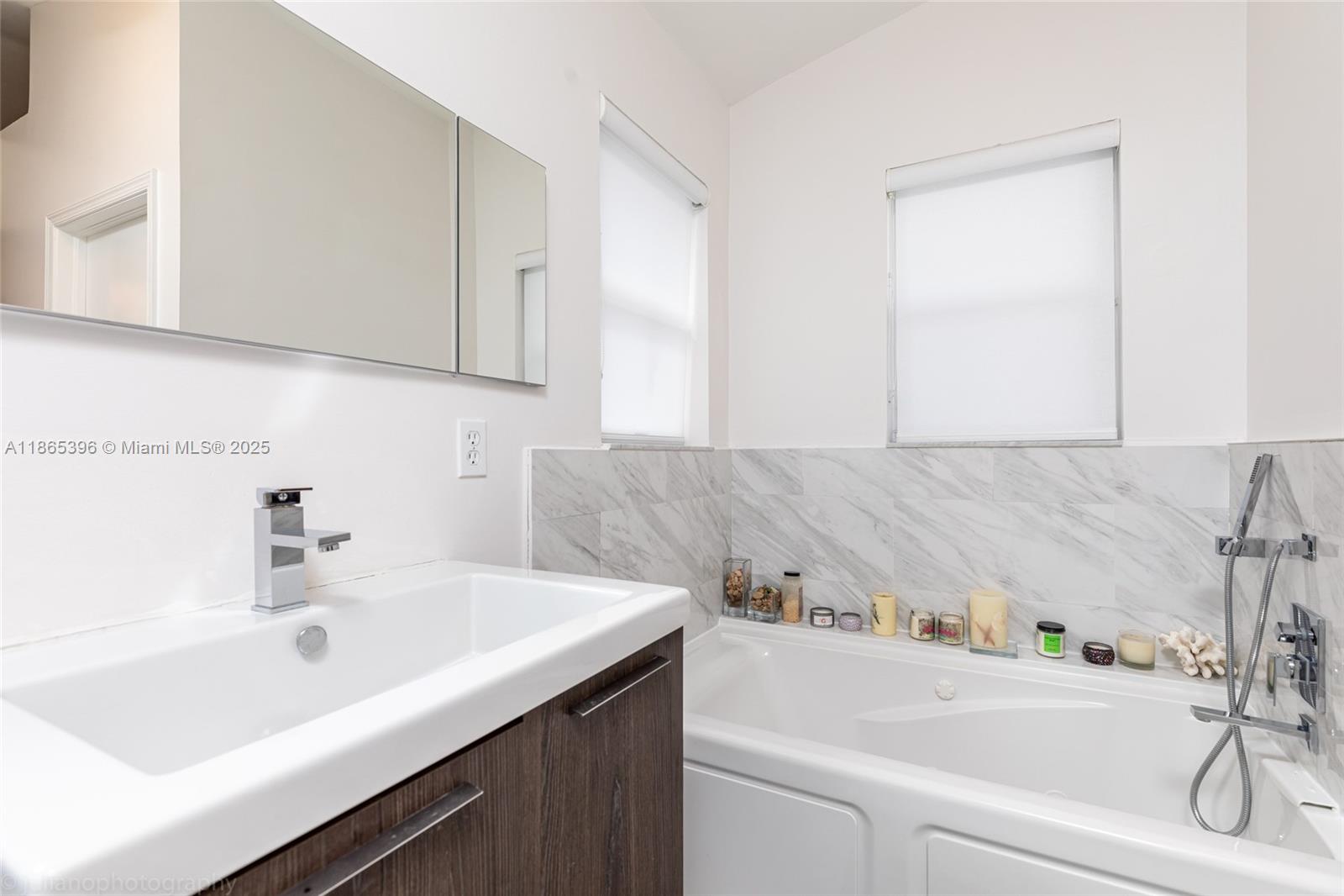 4913 Southwest 32nd Way Hollywood, FL 33312 - Photo 27 of 27 a bathroom with a sink and a bathtub