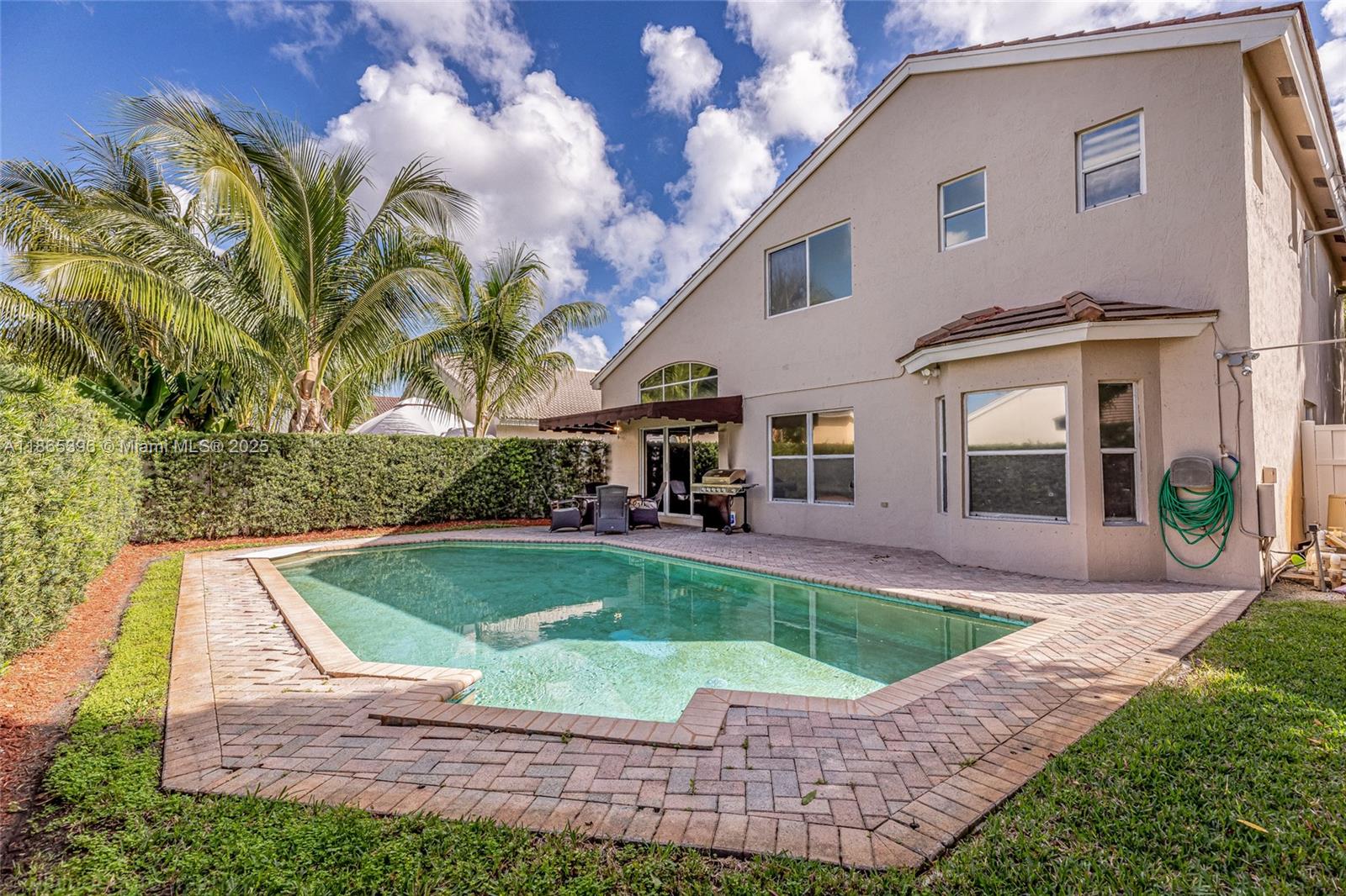 4913 Southwest 32nd Way Hollywood, FL 33312 - Photo 5 of 27 a view of a house with a swimming pool