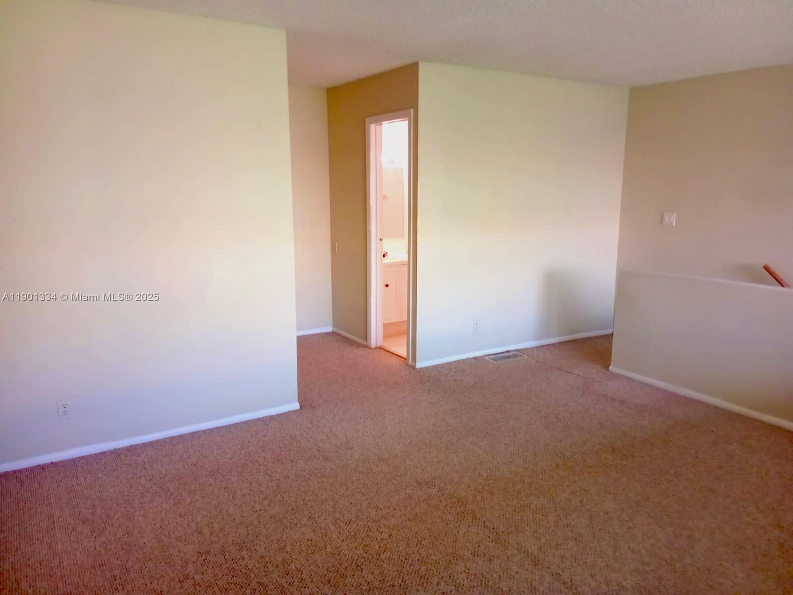 18051 Northwest 68th Avenue, Unit J102 Hialeah, FL 33015 - Photo 9 of 15 a view of an empty room
