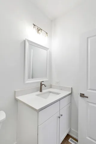 a bedroom with bed couch and window