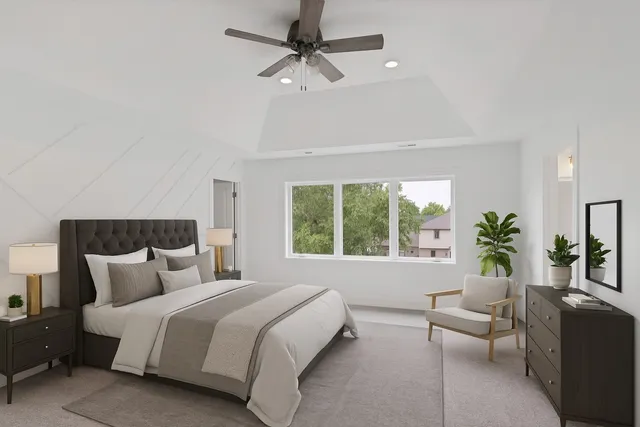 a view of a room with a ceiling fan and wooden floor