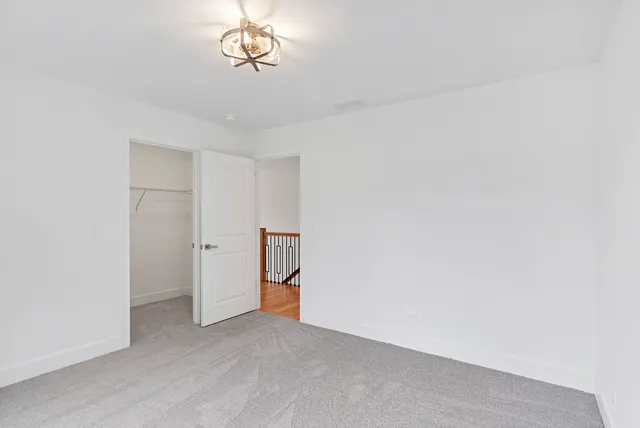 a view of empty room with a fan