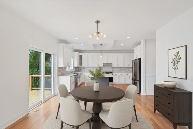 a large kitchen with a lot of counter space and a wooden floor