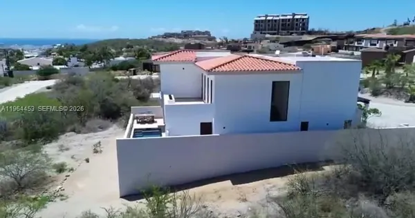 a aerial view of a house with a yard