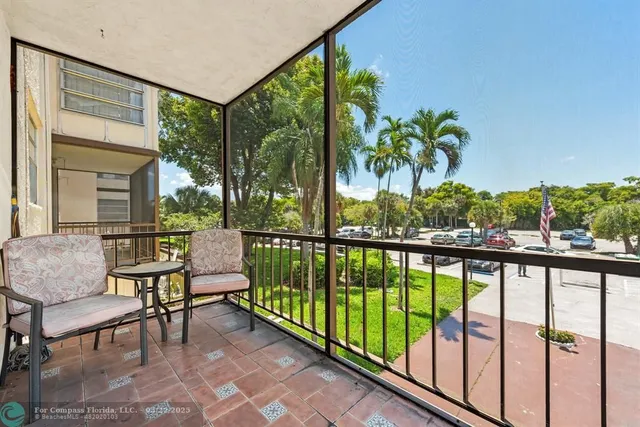 a view of a street view from a balcony