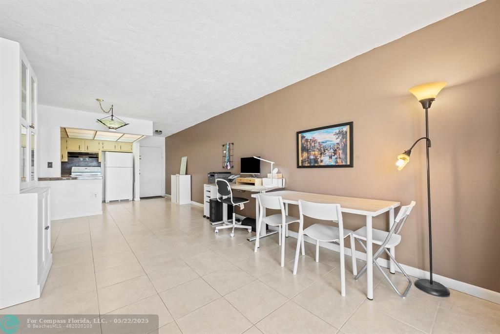 7100 Northwest 17th Street, Unit 218 Plantation, FL 33313 - Photo 7 of 13 a dining room with furniture and window