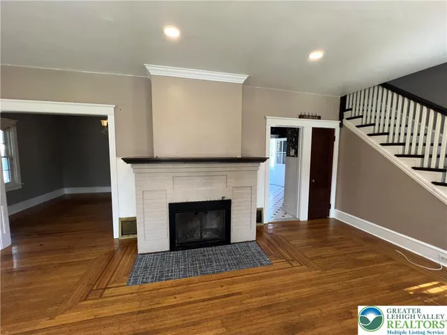 a view of an entryway with wooden floor