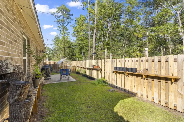 a view of a porch with furniture and garden