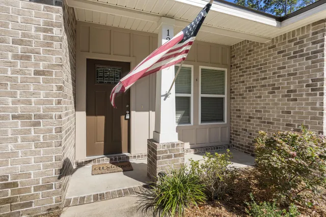 a view of a backyard with sitting area