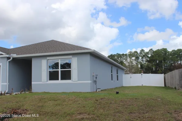 a house with yard in front of it