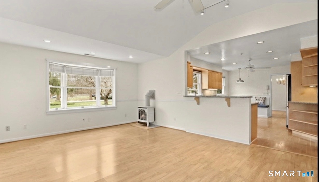 511 Roxbury Road Stamford, CT 06902 - Photo 7 of 19 a view of kitchen and hall with wooden floor