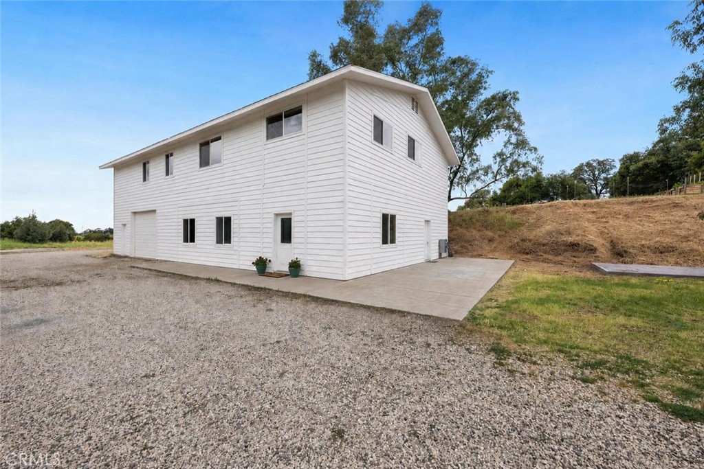 2728 Pentz Road Oroville, CA 95965 - Photo 3 of 52 a view of a white house with a yard