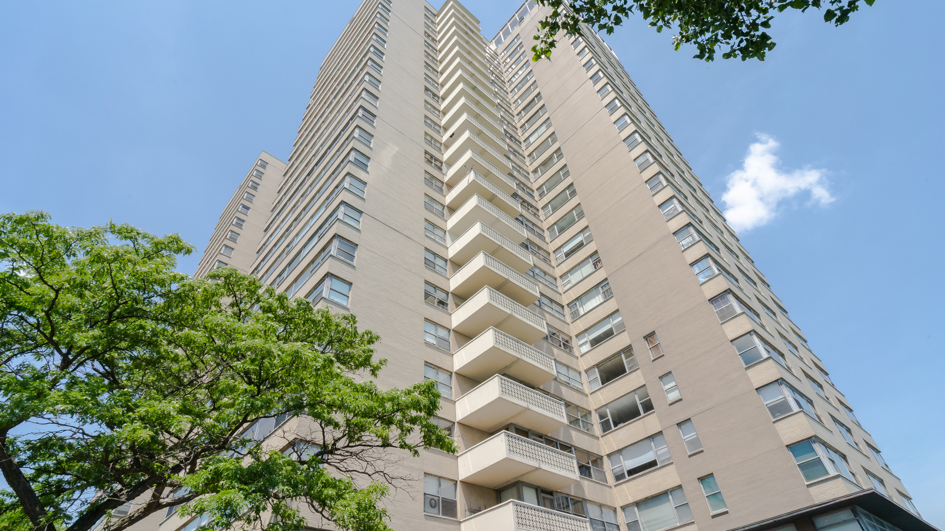 6301 North Sheridan Road, Unit 22B Chicago, IL 60660 - Photo 1 of 14 a front view of a multi story building