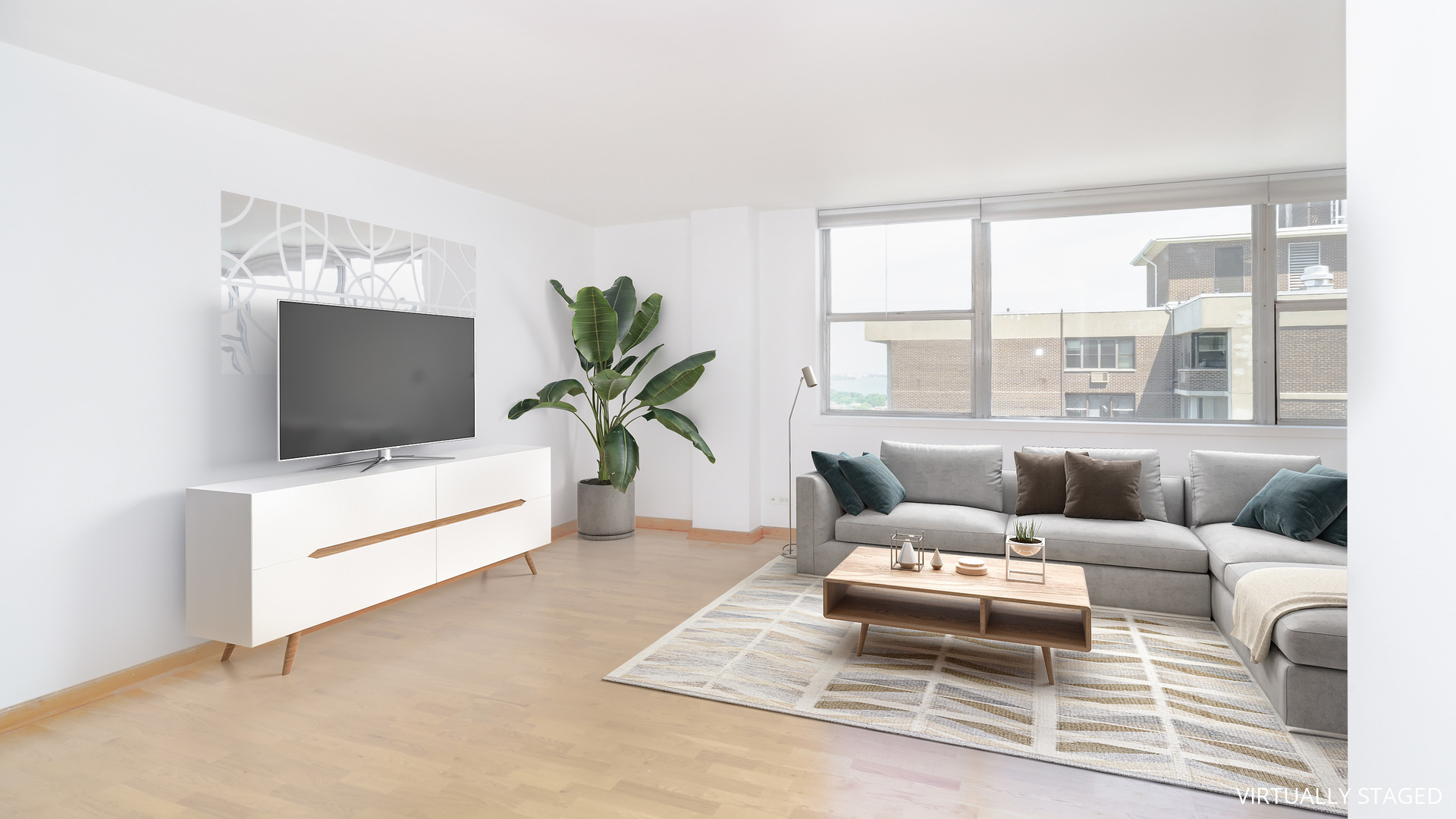 6301 North Sheridan Road, Unit 22B Chicago, IL 60660 - Photo 4 of 14 a living room with furniture and a flat screen tv