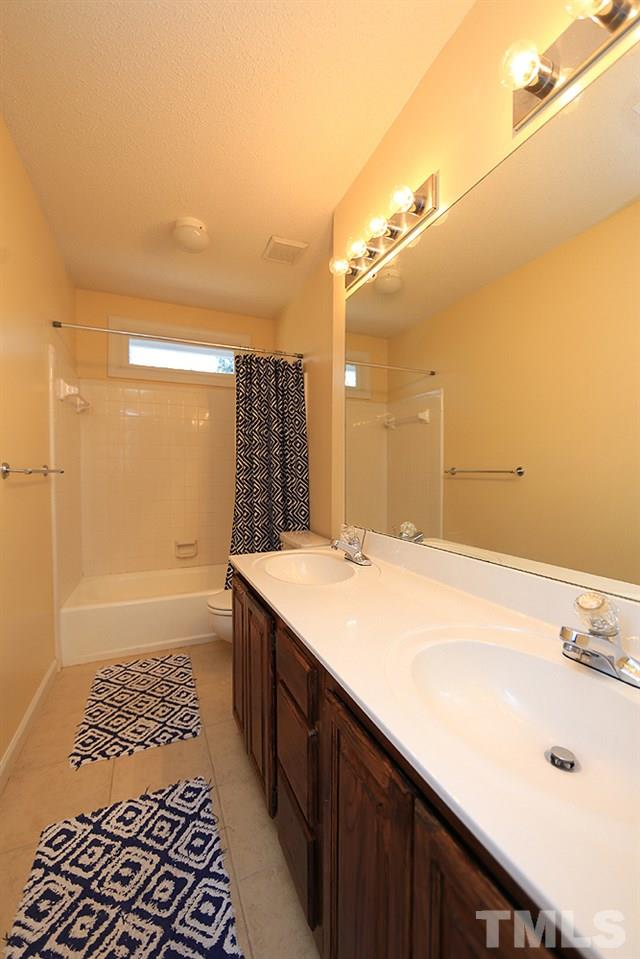5628 Raddington Street Raleigh, NC 27613 - Photo 18 of 25 Double vanity in hall bath.