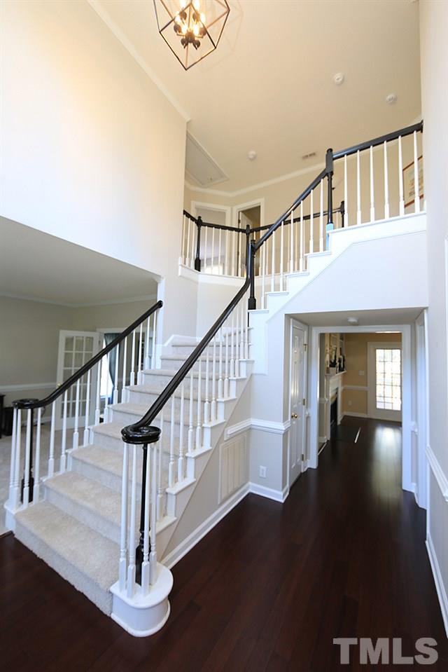5628 Raddington Street Raleigh, NC 27613 - Photo 3 of 25 Grand two-story entry foyer with hardwood floors.