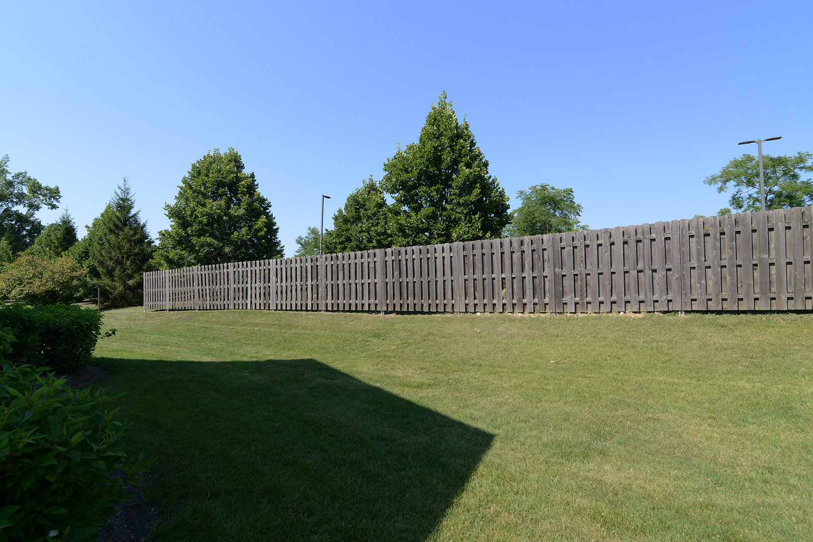 600 Eastview Court, Unit X1 Schaumburg, IL 60194 - Photo 32 of 35 a view of garden with a wooden fence