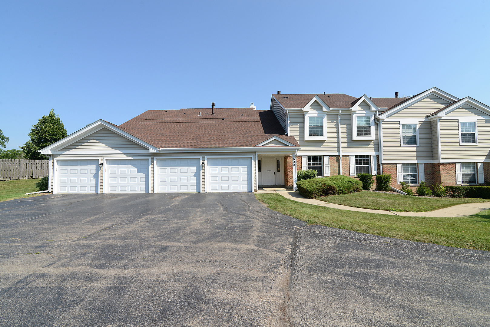 600 Eastview Court, Unit X1 Schaumburg, IL 60194 - Photo 34 of 35 a front view of a house with a yard