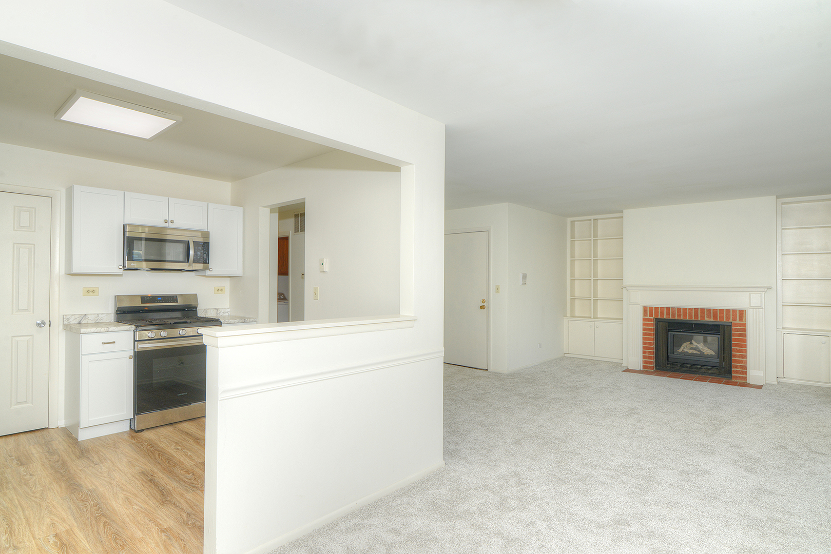600 Eastview Court, Unit X1 Schaumburg, IL 60194 - Photo 5 of 35 a view of open kitchen with a sink stove and refrigerator