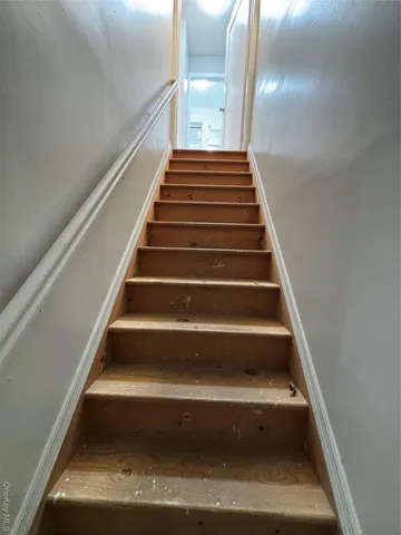 a bathroom with a toilet sink and shower