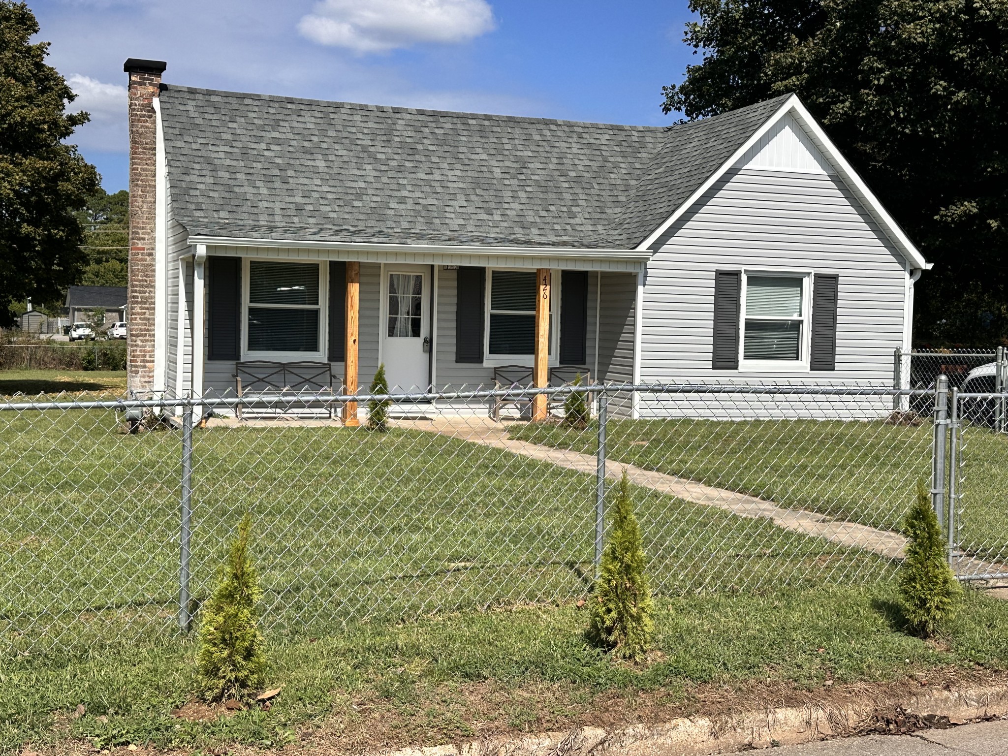 a front view of a house with garden