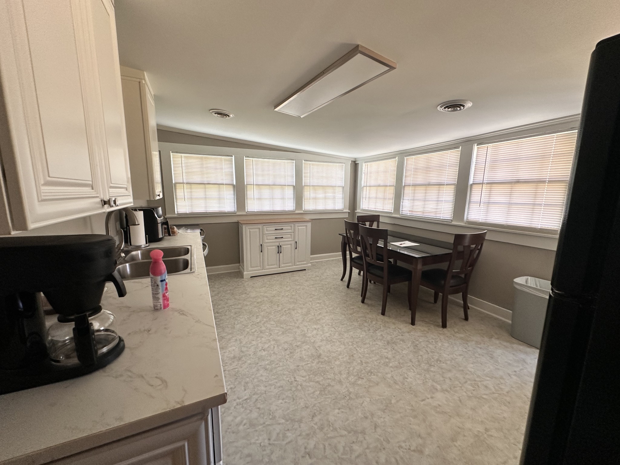 426 Frank Street Lawrenceburg, TN 38464 - Photo 14 of 17 a kitchen with a sink a counter and chairs
