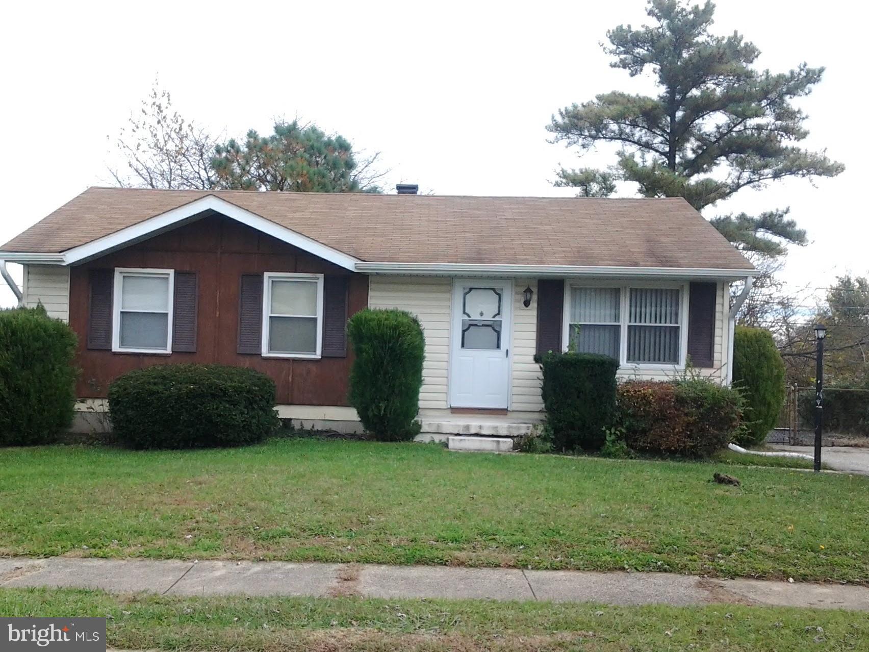 3113 Rheims Road Baltimore, MD 21244 - Photo 1 of 16 a front view of a house with a garden and yard