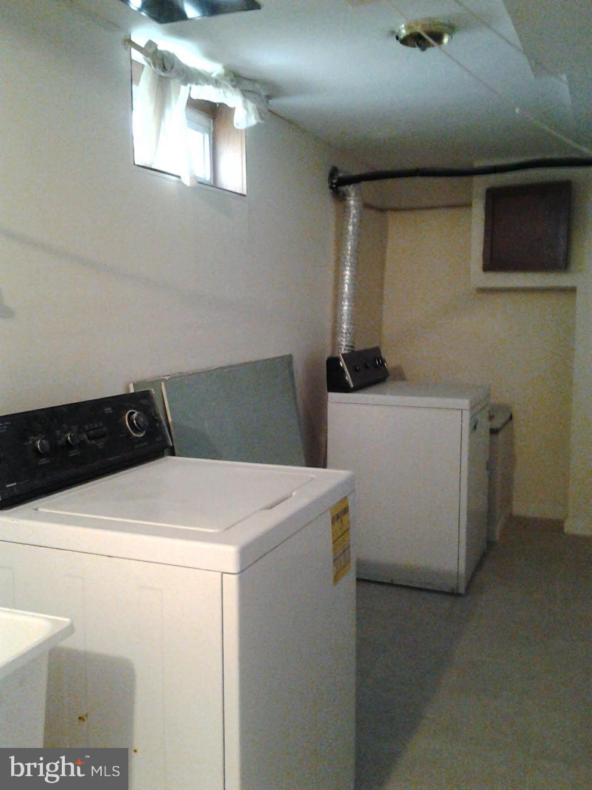 3113 Rheims Road Baltimore, MD 21244 - Photo 16 of 16 a utility room with dryer and washer