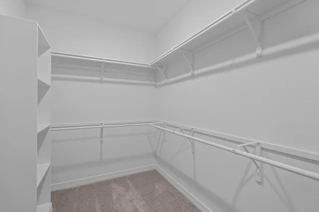 a room with pool table and windows