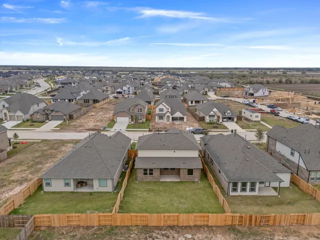 a bedroom with a bed and a table