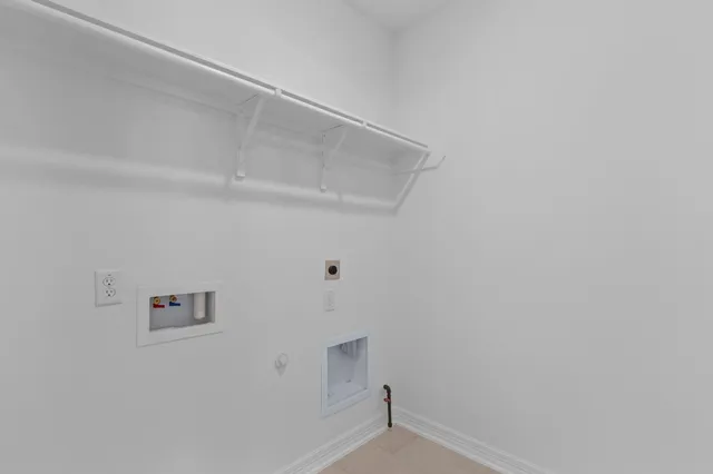 a living room with furniture kitchen and a table