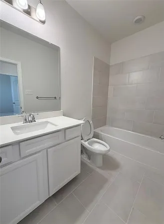 a bathroom with a double vanity sink toilet and shower