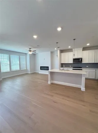 a view of kitchen with wooden floor