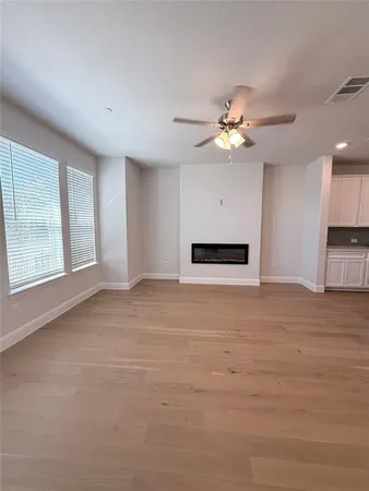 a view of empty room with fan