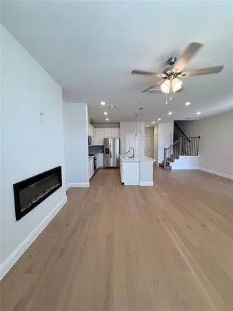 a view of a kitchen with a stove cabinets and a workspace